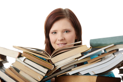Young woman behind books